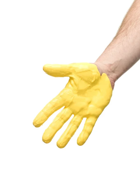 Mano con pintura amarilla — Foto de Stock