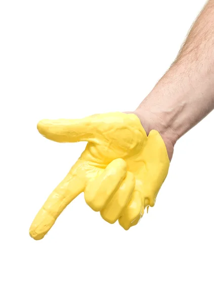 Sárga festett kéz mutató — Stock Fotó
