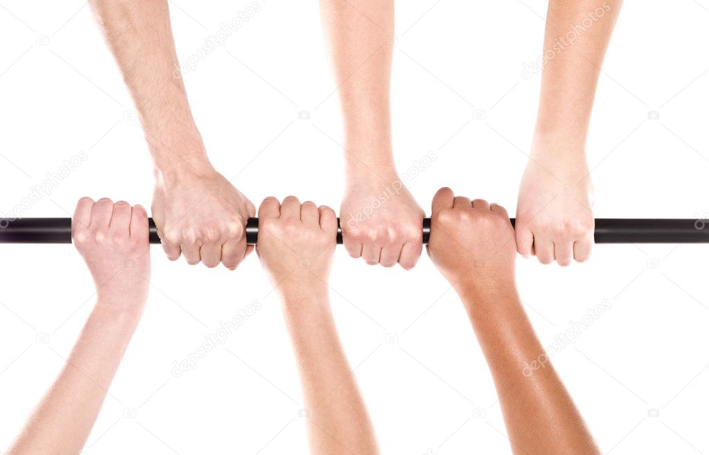 Six human hands holding the same stick
