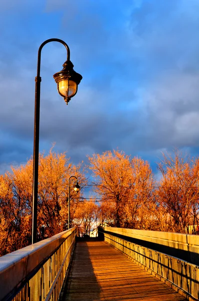 stock image Sunset and wooden bridge