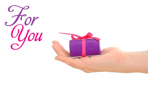 Woman Hand Giving Purple Present Copyspace Text — Stock Photo, Image
