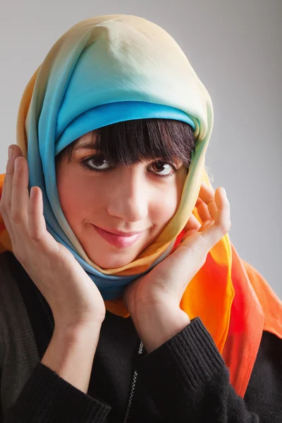 Young woman in colorful head scarf — Stock Photo, Image