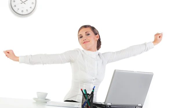 Pretty Young Businesswoman Stretching Her Hands While Sitting Her Desk — Stock Photo, Image