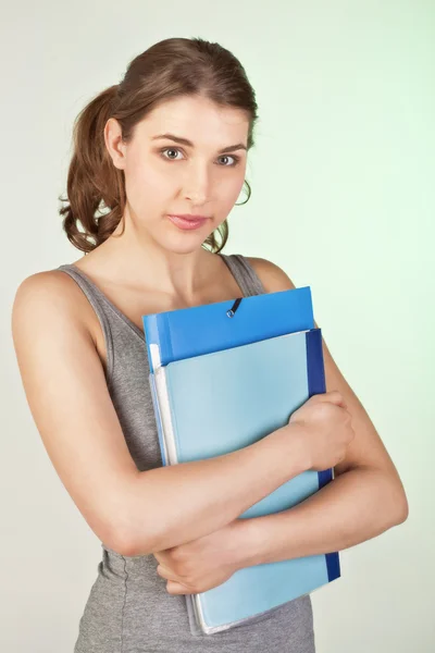 Girl with blue folders — Stock Photo, Image