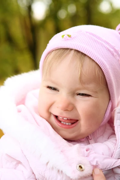 stock image Little emotional girl on the park background