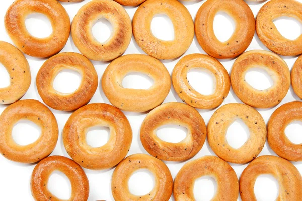 Saborosos bagels colocados na forma de fundo — Fotografia de Stock