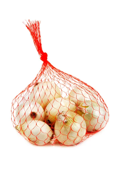 Paket kırmızı net üzerinden ışık soğan — Stok fotoğraf