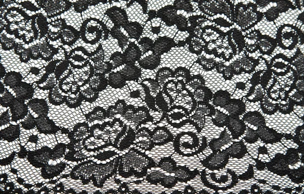 Фон из черного кружева с рисунком в форме цветка — стоковое фото