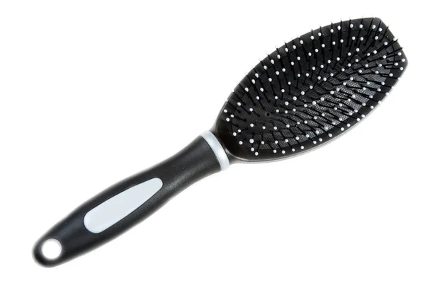 Black massage plastic comb — Stockfoto
