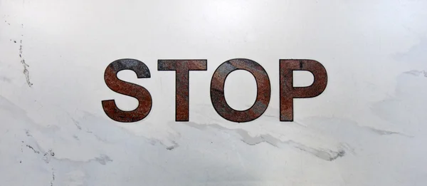 Napis stop na marmur jasny — Zdjęcie stockowe