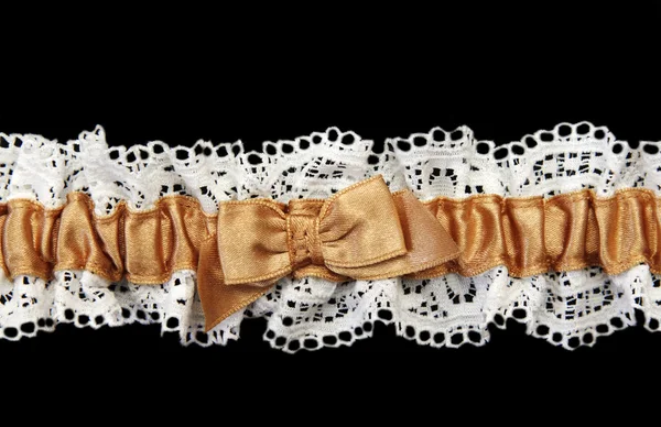Blanching feminine garter with beige satin band — Stock Photo, Image