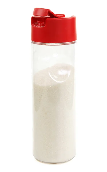 透明瓶中的红色盖子和糖 — 图库照片
