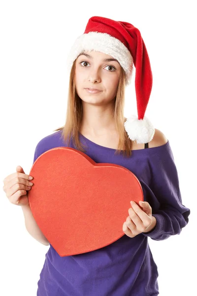 Krásná dívka v červeném klobouku santa — Stock fotografie