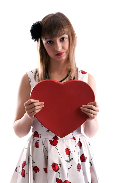 Güzel bir kız elbise kırmızı renkli ve kalp içinde el ile — Stok fotoğraf
