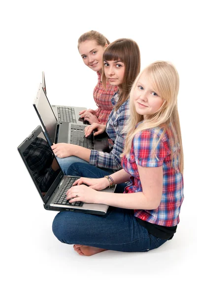 Three girls with laptops — Stock Photo, Image
