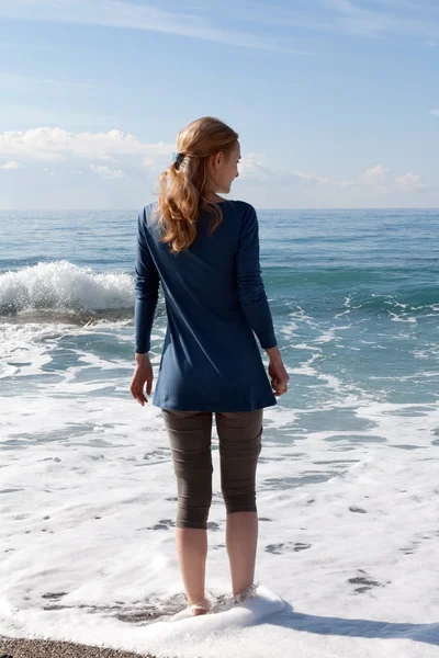 stock image The girl on the beach in a dress