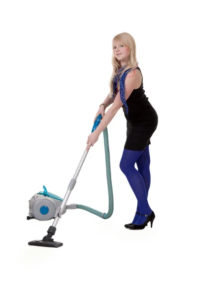 The girl in blue tights with a vacuum cleaner — Stock Photo, Image