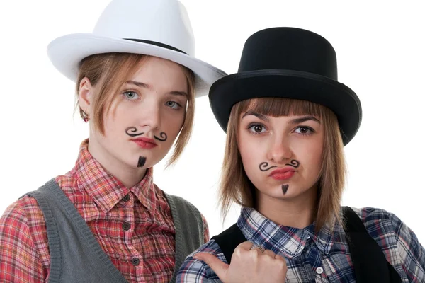 Zwei Mädchen mit bemalten Schnurrbärten — Stockfoto