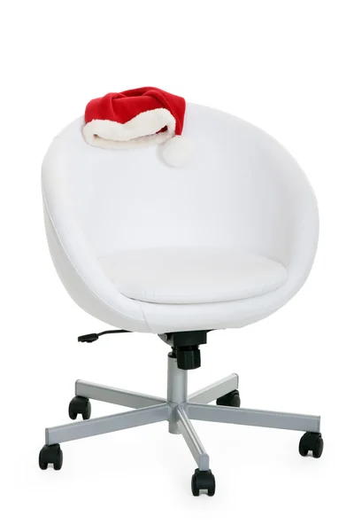 Cadeira de luz e chapéu de Papai Noel — Fotografia de Stock