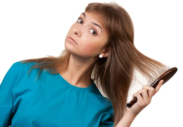 Young beautiful girl is combed — Stock Photo, Image