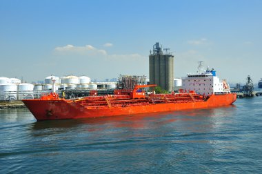 Loading of chemical tanker in port clipart