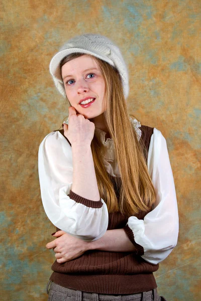 stock image Young blonde teenage girl with white wool hat