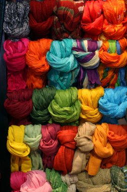 Colorful display with bunch of wrapped scarves clipart