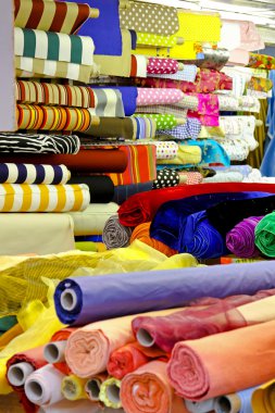 Textile fabric rolls for fashion clothing industry clipart