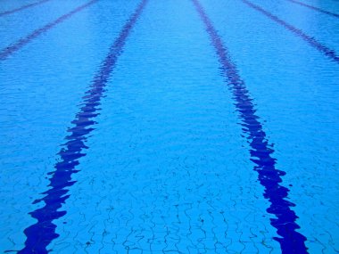 Trembling surface of an Olympic size swimming pool clipart