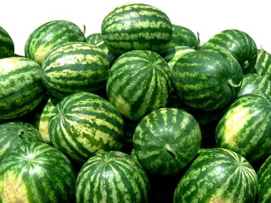 Bunch of fresh organic green watermelons on a market clipart