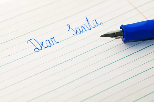 stock image Child writes a letter to Santa Claus