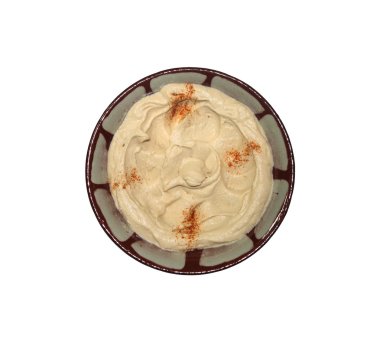 A Lebanese traditional plate of hummus dip isolated on white. clipart