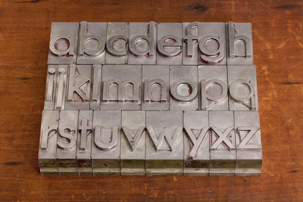 Alphabet in metal printing blocks — Stock Photo, Image