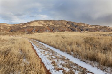 Ranch road in a mountain valley clipart