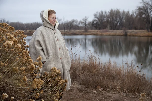 stock image Senior woman enjoys a walk outdoors