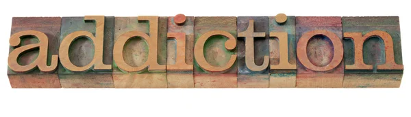 Słowo uzależnienie w typ typografia — Zdjęcie stockowe
