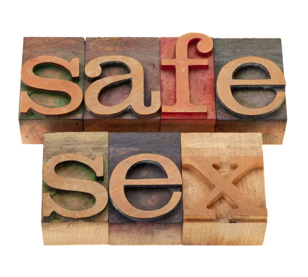 Palabras de sexo seguro en fuentes wood —  Fotos de Stock