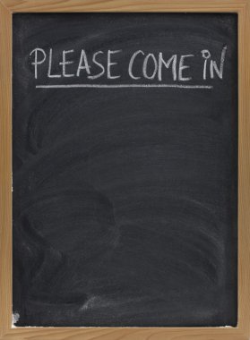 Please come in invitation handwritten with white chalk on a small blackboard with eraser smudges, copy space below clipart