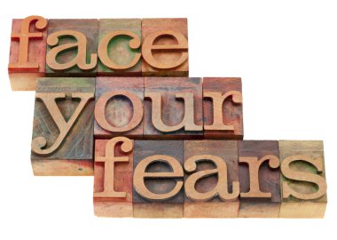 Face your fears phrase in letterpress type clipart