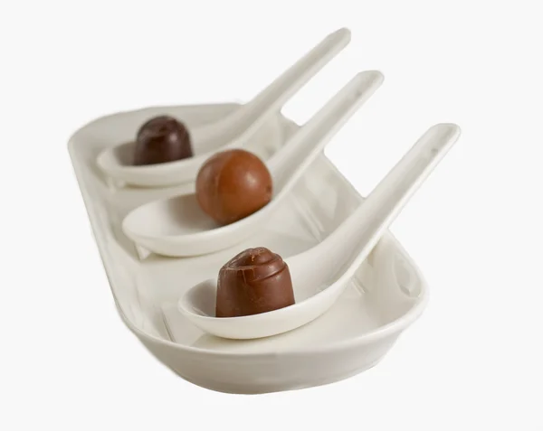 Three Chocolates White Spoons White Background — Stock Photo, Image