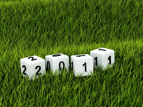 Giocattoli di nuovo anno sopra erba verde — Foto Stock