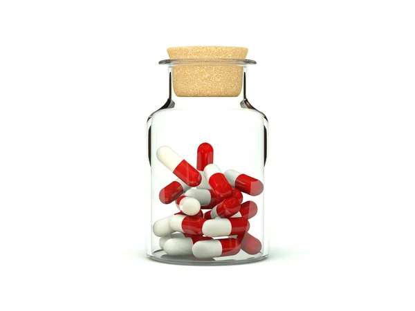 Comprimidos em frasco de remédio de vidro — Fotografia de Stock