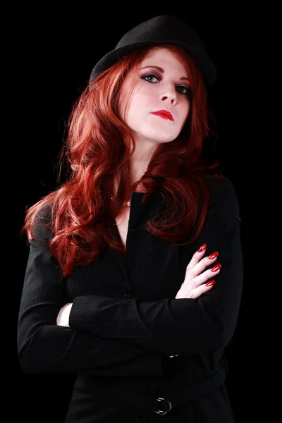 Young caucasian redhead woman in business jacket and hat — Stock Photo, Image