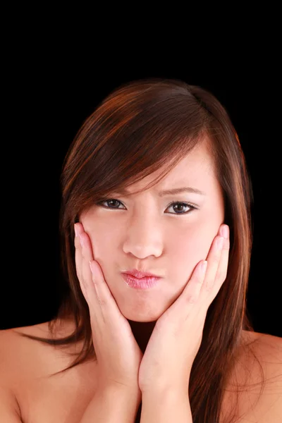 Young Asian American teen girl making a face — Stock Photo, Image