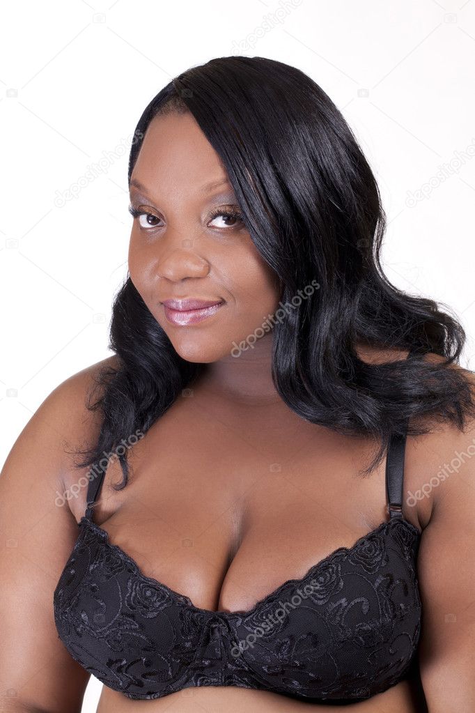 Young African American woman standing in black bra