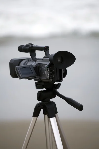 Video camera on tripod at the beach — Stock Photo, Image