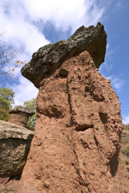 Huge rocks like mushroom, blue sky with clouds. Crimea. clipart