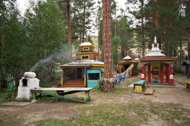 Sacrosanct place.Buddhist chorten in Buryat forest clipart