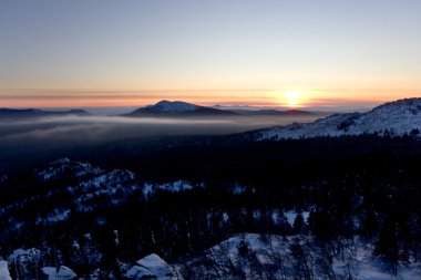 Sunset in Ural mountains.Taiga,Russia.Taganay park clipart