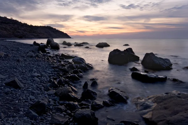 stock image Sunrise at the Black Sea coast, Crimea mountains